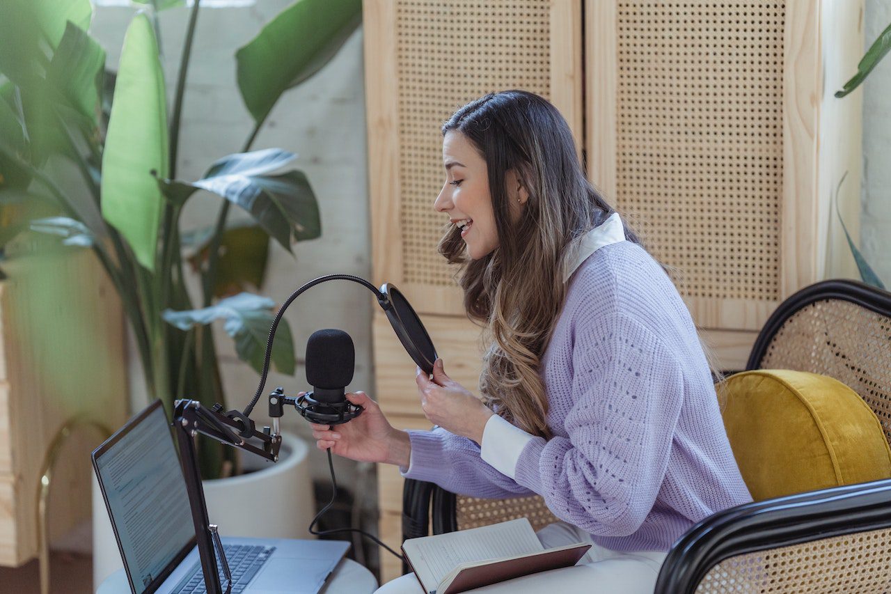 woman making a radio jingle