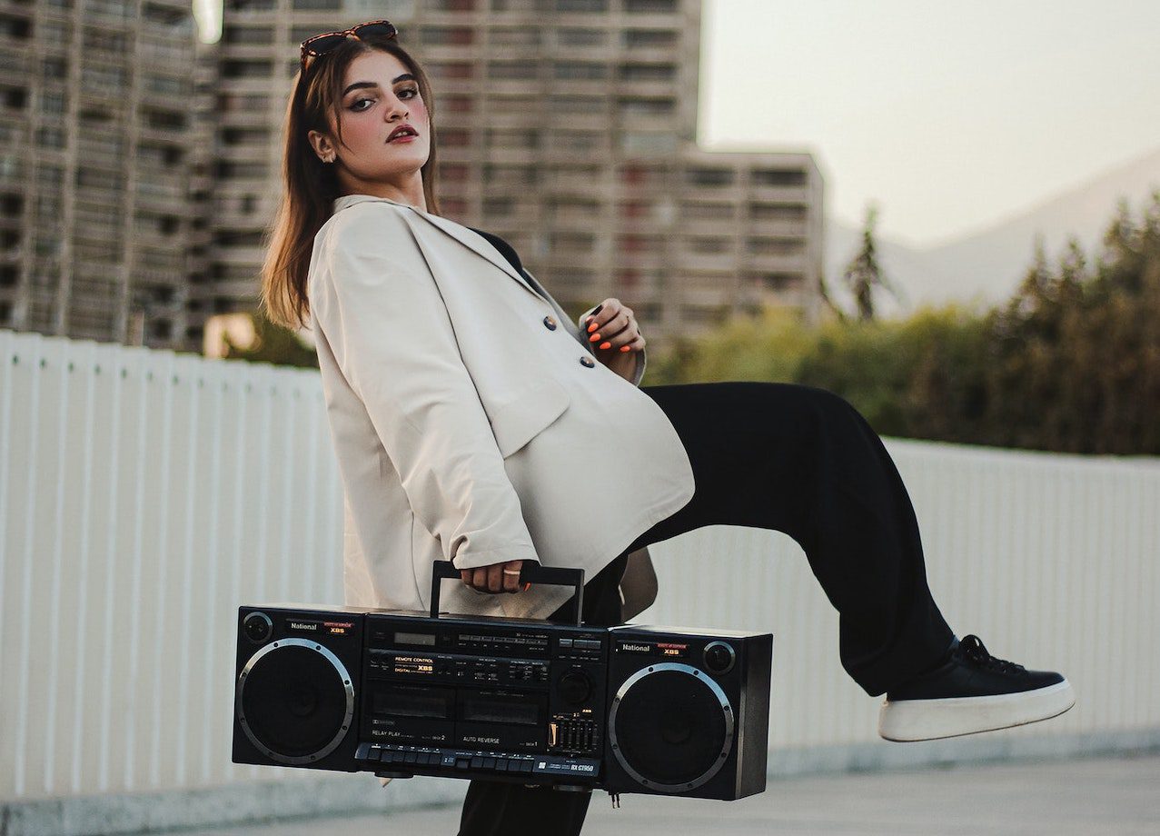 woman holding a radio