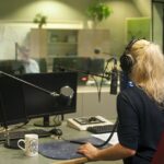 Woman inside a radio booth