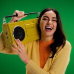 woman holding a radio